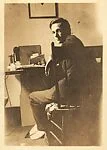 [Walker Evans Seated at Desk, 13 East 14th Street, New York]