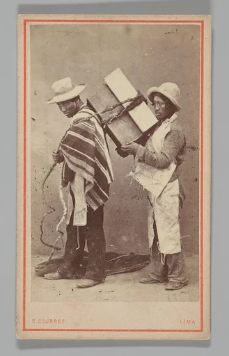[Studio Portrait: Two Men, one with Box Tied to his Back, Lima]