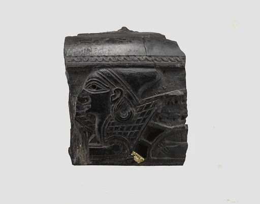 Cosmetic box fragment carved in relief with the head of a sphinx