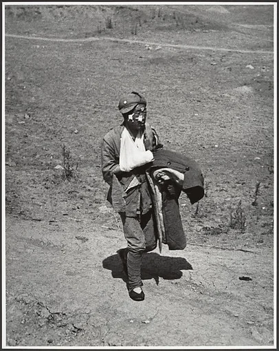 A wounded soldier treks six miles to a hospital behind the front lines after the Chinese victory at Taierhchwang, April