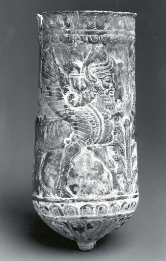Beaker with winged human-headed bulls flanking a stylized tree