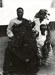 Family portrait with one boy and father in Kente cloth