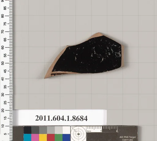 Terracotta fragment of a stemless kylix (drinking cup)