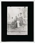 Family with two children, parents in Ewe kente cloth with painted backdrop — Alex Agbaglo Acolatse