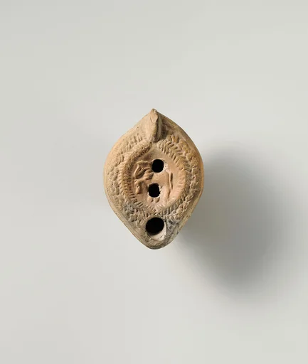 Terracotta oil lamp