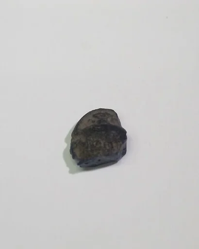 Mold-pressed amulet or fragment