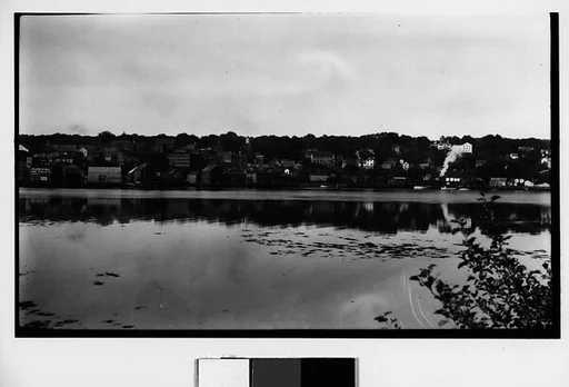 [Houses and Train on Railroad Track, Seen from Across River]