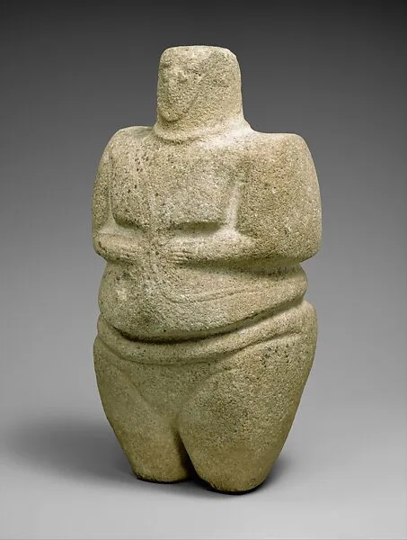 Standing female figure wearing a strap and a necklace — Unknown
