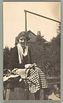 [Jane Beach Evans Seated Before Fence]
