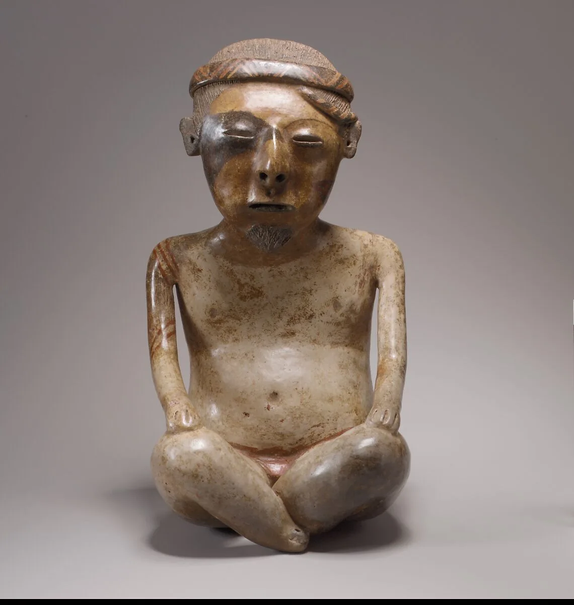 Seated Male Figure — Unknown
