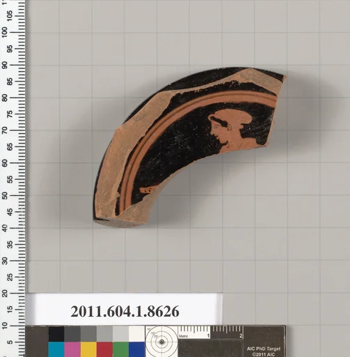Terracotta fragment of a stemless kylix (drinking cup)