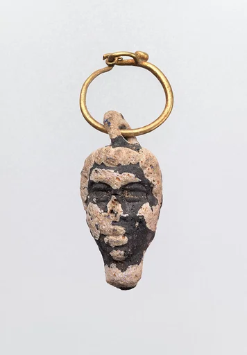 Gold hoop with glass pendant in the form of a youthful head