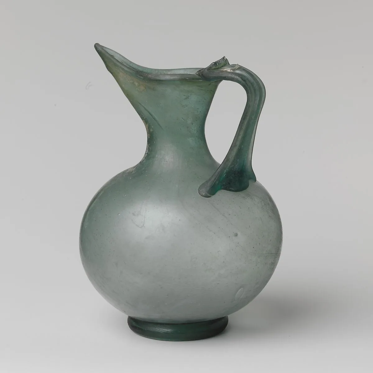Glass spouted jug — Unknown