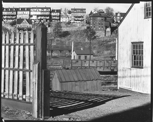 [Railroad Yard Below Workers' Houses with Wooden Fence and Barn in Foreground, Bethlehem, Pennsylvania]