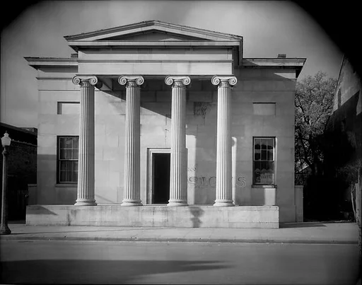 [Greek Revival Building with "SIGNS" Painted on Façade, Natchez, Mississippi]