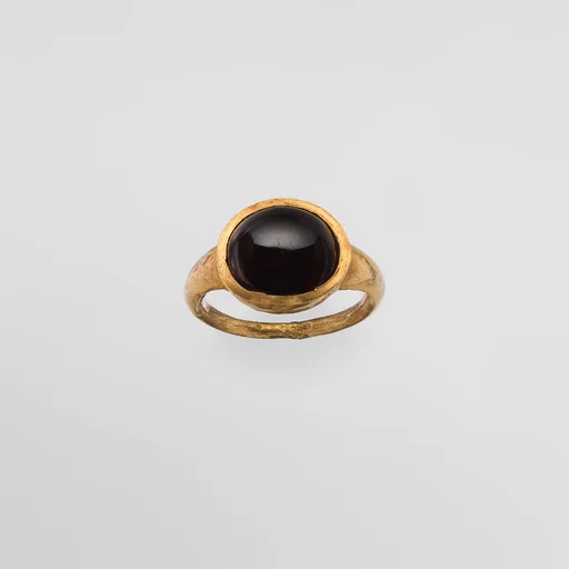 Gold and garnet ring