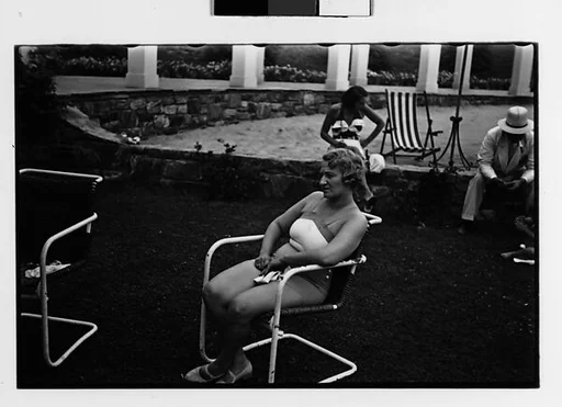 [Two 35mm Film Frames: Woman in Bathingsuit Seated in Tubular Chair at Country Club?]