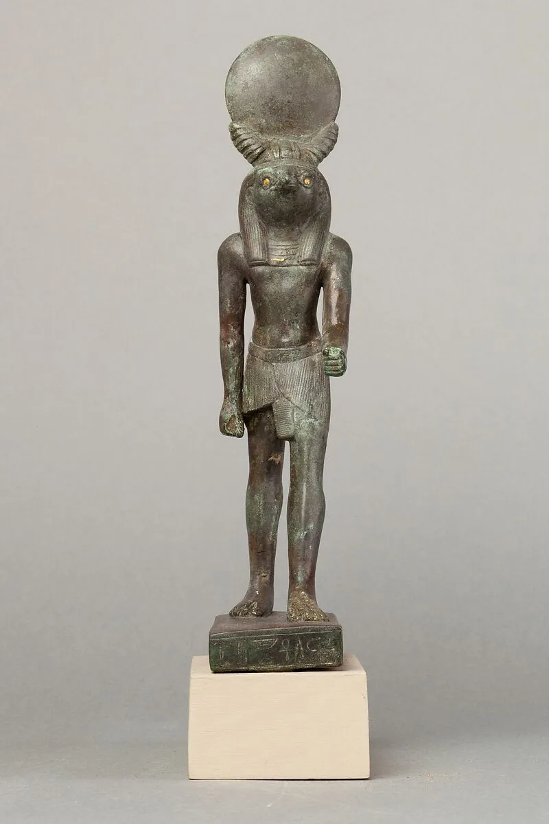 An ancient base asking blessings from Heka for the Scribe of the Library of Atum Pa-kap, son of the Prophet of Atum Pa-iry-kap and the mistress of the House Hr-ib-Wadjet; statue modern above the ankles — Unknown