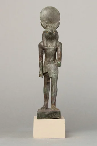 An ancient base asking blessings from Heka for the Scribe of the Library of Atum Pa-kap, son of the Prophet of Atum Pa-iry-kap and the mistress of the House Hr-ib-Wadjet; statue modern above the ankles