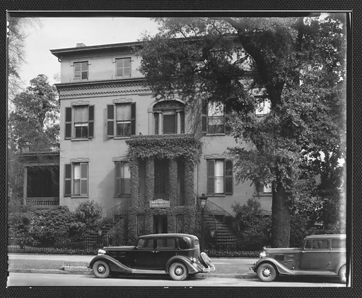 [Brick Greek Revival Building with Ivy-Covered Entry Porch and Parked Cars in Foreground, Funeral Home, Augusta, Georgia]