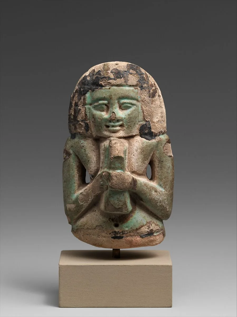Female figure playing a lyre — Unknown