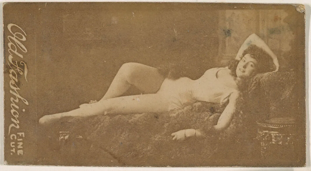 Actress reclining on sofa, from the Actresses series (N664) promoting Old Fashion Fine Cut Tobacco — Unknown