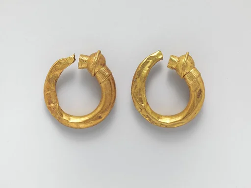 Gold trumpet-shaped earrings