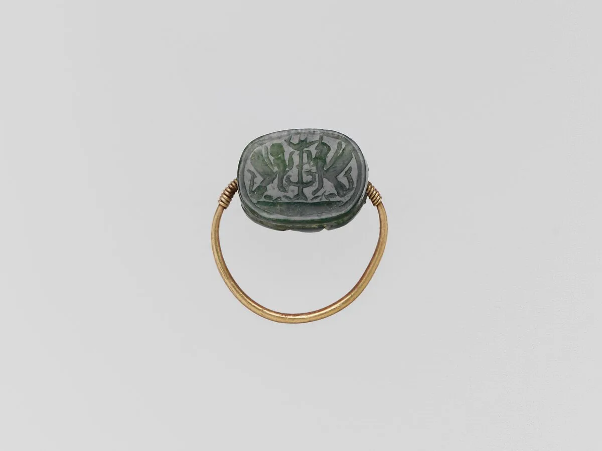 Gold hoop with plasma scarab — Unknown