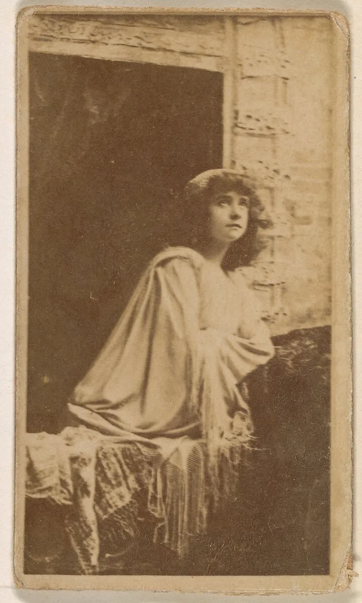 Actress posed in open window, from the Actresses series (N245) issued by Kinney Brothers to promote Sweet Caporal Cigarettes — Kinney Brothers Tobacco Company