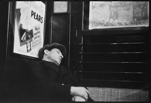 [Four 35mm Film Frames: Subway Passengers, New York City: Sleeping Man in Car Corner, Aunt Jemima Pancake Mix Advertisement in Subway Car, Woman in Fur Collar, Row of Passengers]