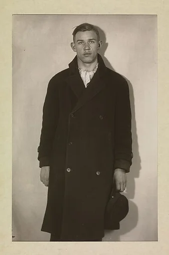 [Unemployed Man in Winter Coat, Hat in Hand]