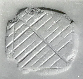 Loop-handled rectangular stamping device — Unknown