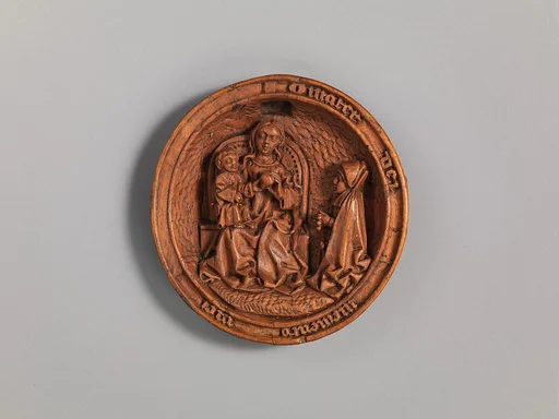 Half of a Prayer Bead with the Prayer of the Rosary