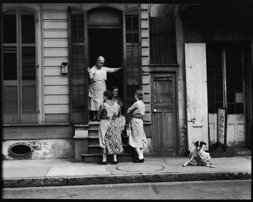 [Women Talking Outside Shuttered House, New Orleans, Louisiana]