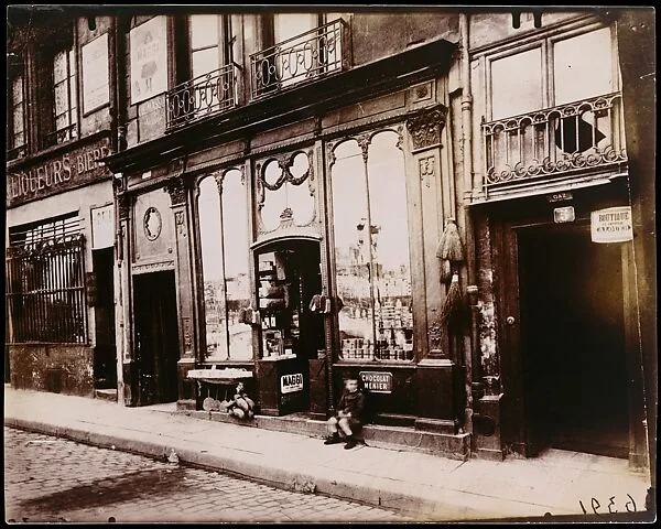 Shop front of "Courone d'or," Quai Bourbon — Eugène Atget