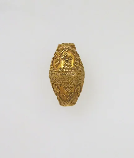 Bead ornamented with coarse granules