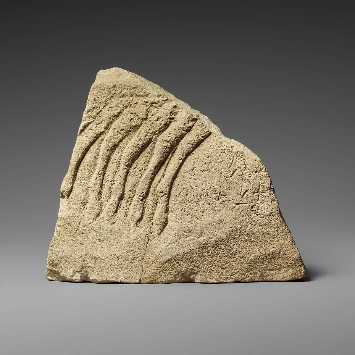 Fragment of a limestone votive relief with a quadriga (?) — Unknown