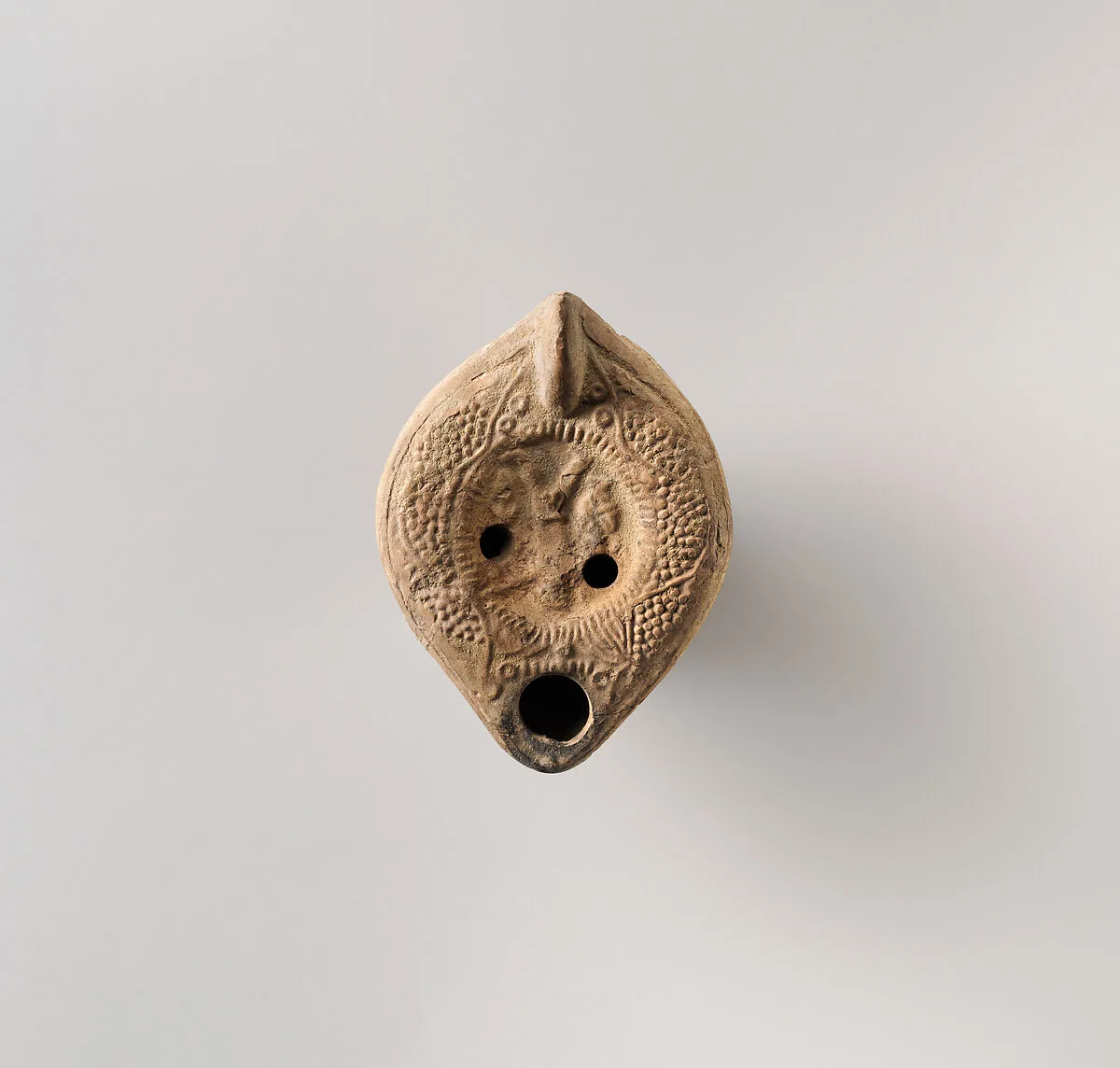 Terracotta oil lamp — Unknown