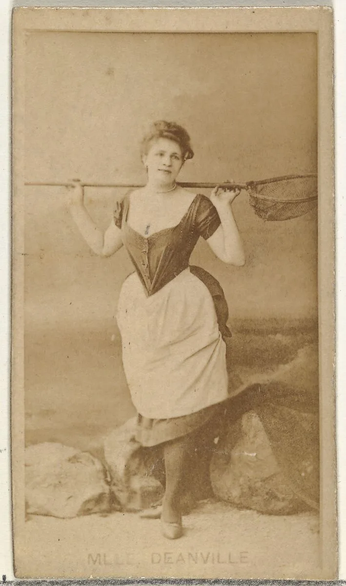 Mlle. Deanville, from the Actors and Actresses series (N145-8) issued by Duke Sons & Co. to promote Duke Cigarettes — American Tobacco Company|W. Duke, Sons & Co.