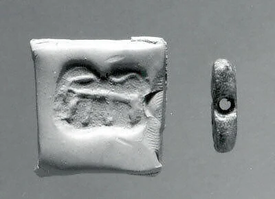 Rectangular plaque seal, indented at string holes