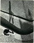 [Pedestrian with a Bottle in Hand, Viewed from Above]