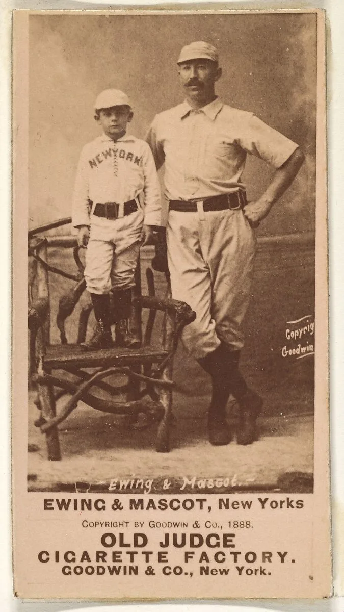 William "Buck" Ewing, Captain and Catcher, with Mascot, New York, from the Old Judge series (N172) for Old Judge Cigarettes — Goodwin & Company