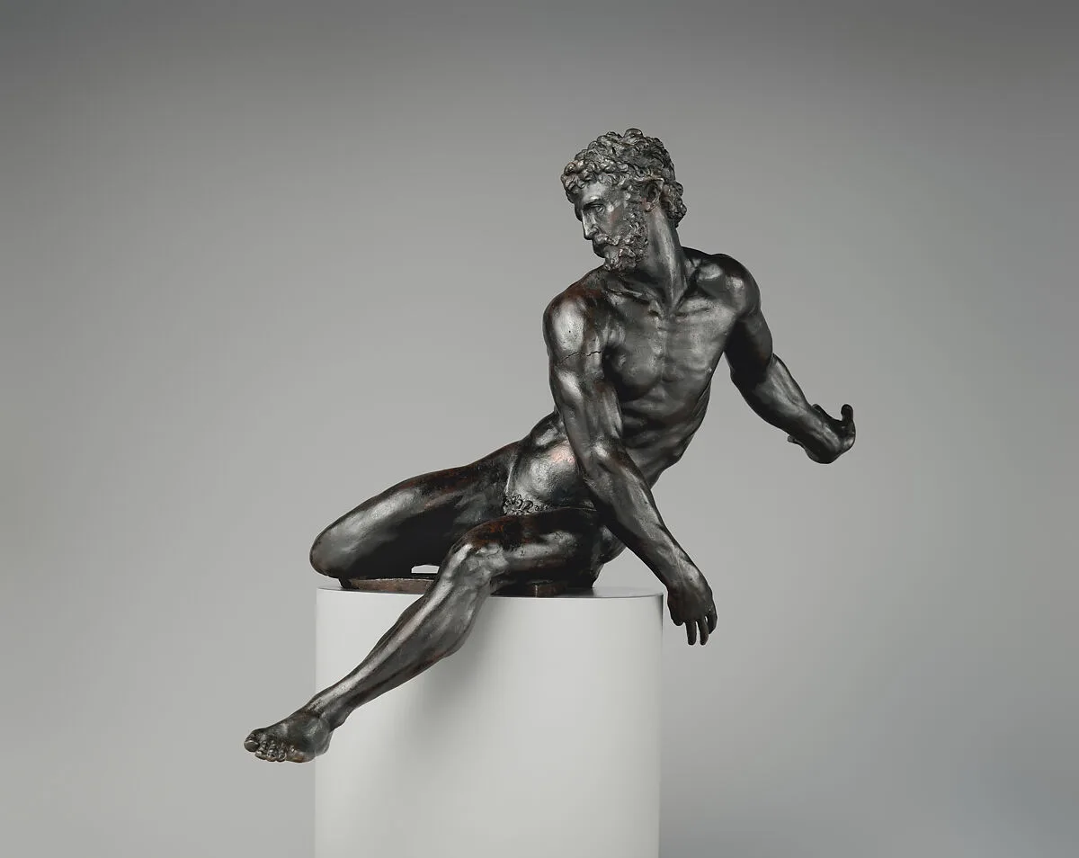 Seated male figure — Unknown