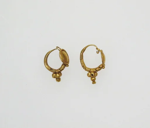 Earring with disk and pendant globules