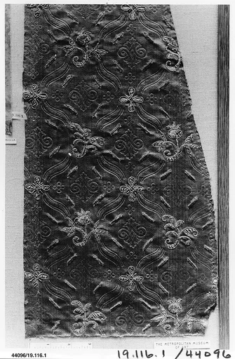 Fragment of satin with stamped, slashed and embroidered decoration