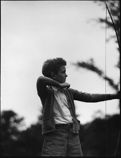 [Blair Fuller Holding Bow and Arrow, Cornish, New Hampshire]