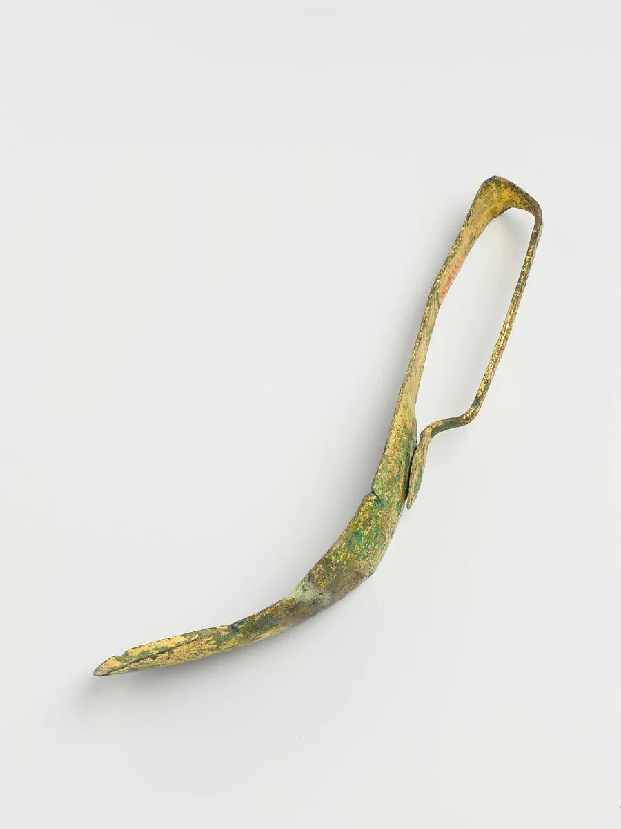 Gilt bronze strigil — Unknown