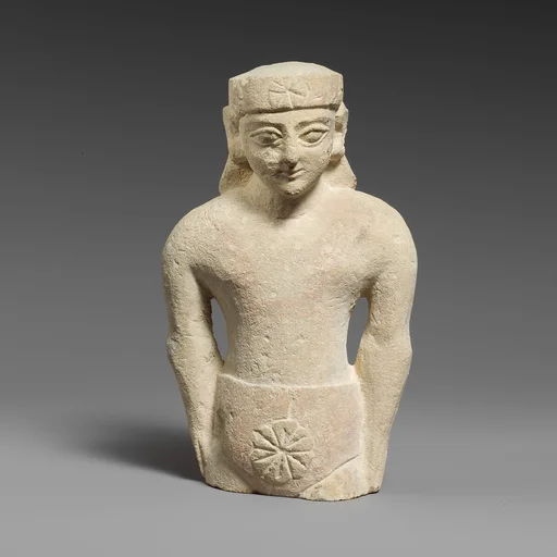 Limestone statuette of a male votary with Cypriot shorts and a diadem