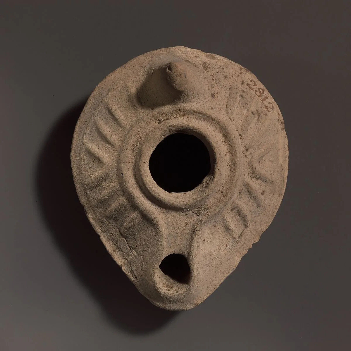 Terracotta oil lamp — Unknown