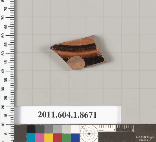 Terracotta fragment of a stemless kylix (drinking cup)